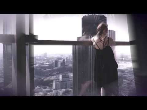 Woman looking over a city in the Love Story campaign